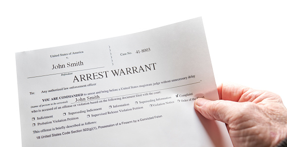 Arrest Warrant with man holding warrant on white background