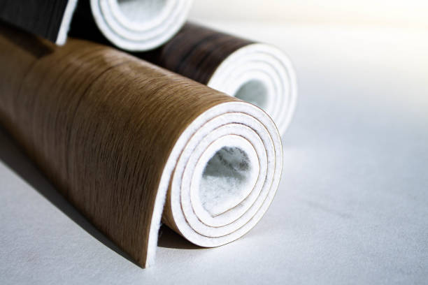 istock Linoleum. Three rolls of linoleum on a white background. 1307858530