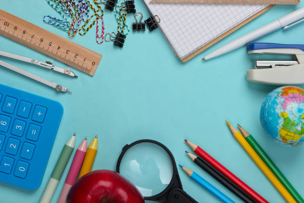 istock Back to school. School and office supplies on blue background. Educational concept. Copy space. Top view. 1307860481