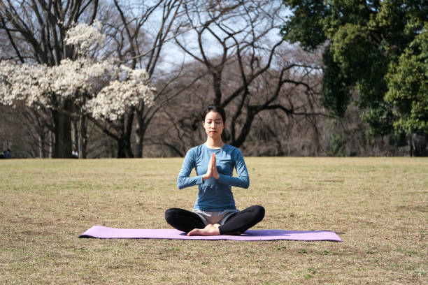 istock Yoga instructor posing lotus position 1307863112