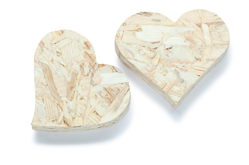 two valentine heart toys made from plywood isolated on white