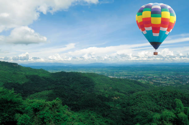 istock High mountain with hot air colorful balloon 1307870660