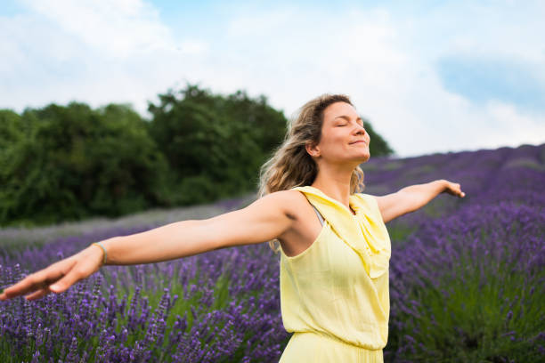 istock Woman enjoying on lavender field 1307871782