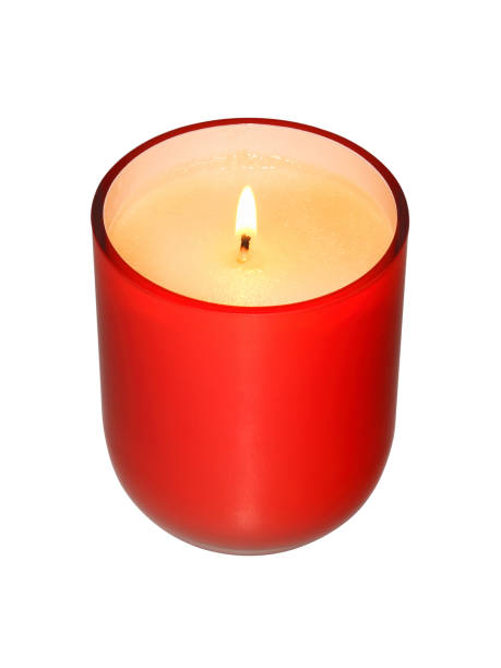 istock White burning candle in red glass on white background 1307871935
