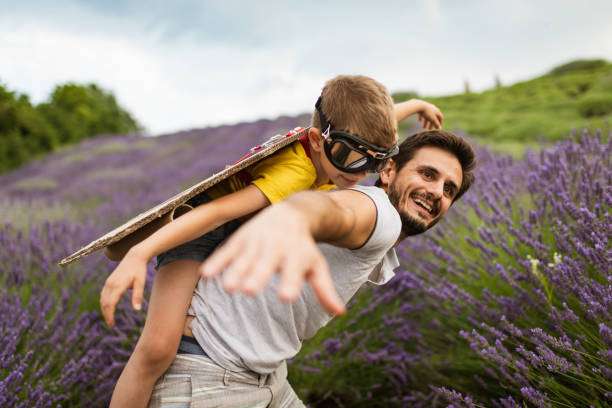 istock Father and son enjoying on lavender field 1307871970