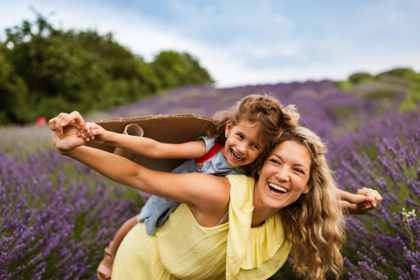istock Mother and daughter enjoying on lavender field 1307872480