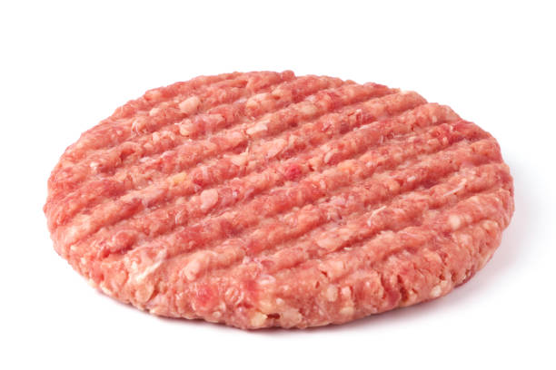 istock Raw beef burger cutlet isolated on white 1307872483