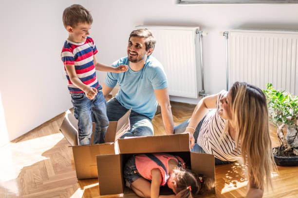 istock Playful family into new home 1307874094