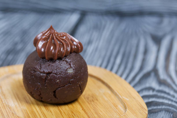 istock Potato cake. Decorated with chocolate cream. 1307874677