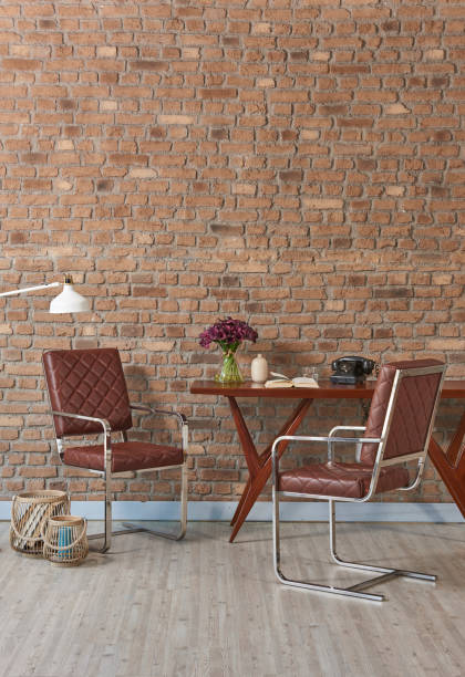 istock modern home interior study room raw brick wall with wooden desk chair 1307874894