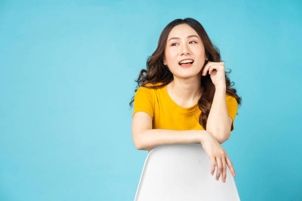 istock Woman sitting on chair 1307874919