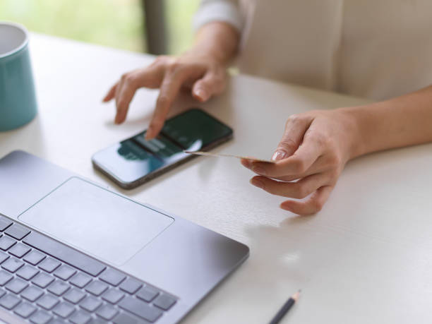 istock Female using internet banking application on smartphone to online payment with debit card 1307875168