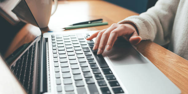 istock Young woman working in home on her laptop computer. 1307875315