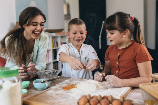 istock mother and kids baking together at home 1307875869