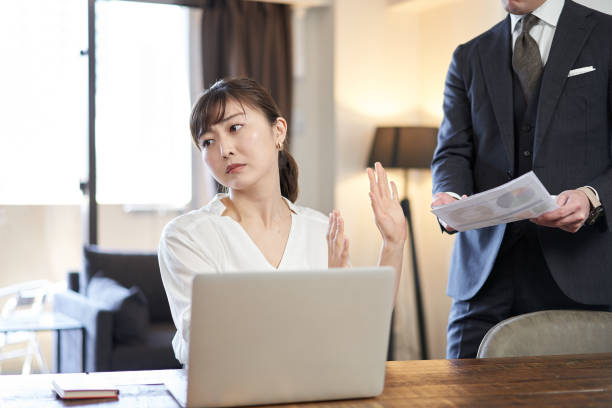 Asian female business woman refusing to work