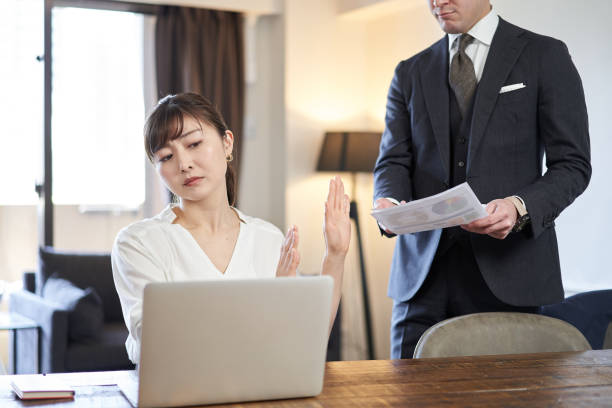 istock Asian female business woman refusing to work 1307875985
