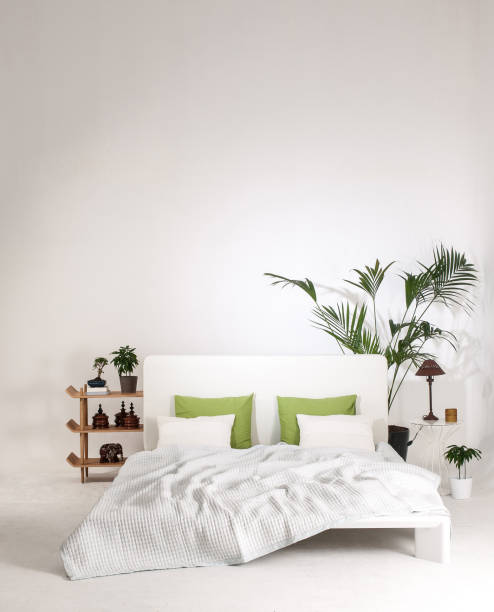 istock modern home interior bed room white wall with flower shelf 1307876993