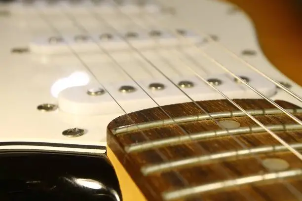 Plug and Neck of a well known E-guitar shape and color