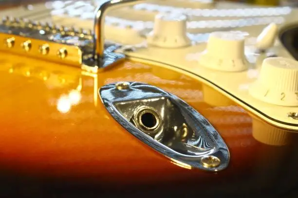 Plug and Neck of a well known E-guitar shape and color