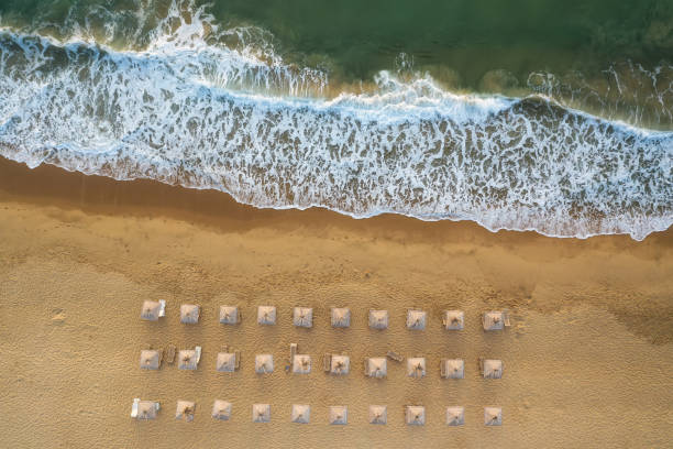 istock Aerial view over an empty beautiful sandy beach 1307878165