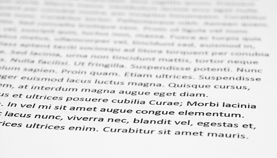 Closeup of lorem ipsum text on white paper.
