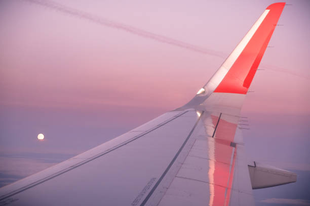 istock airplane window picture with sun on the horizon 1307879553