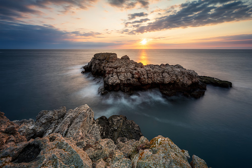 Amazing view with colorful sunrise sky at the rocky coastline of the Black Sea