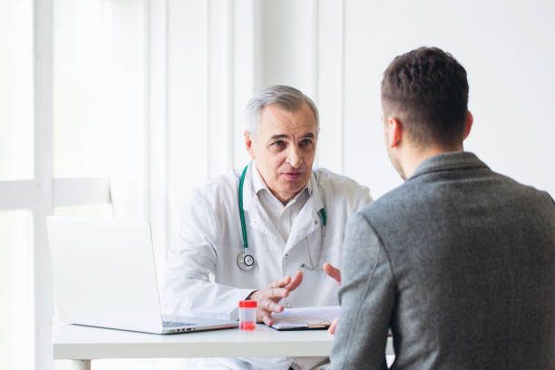 istock Senior doctor consults patient 1307882262