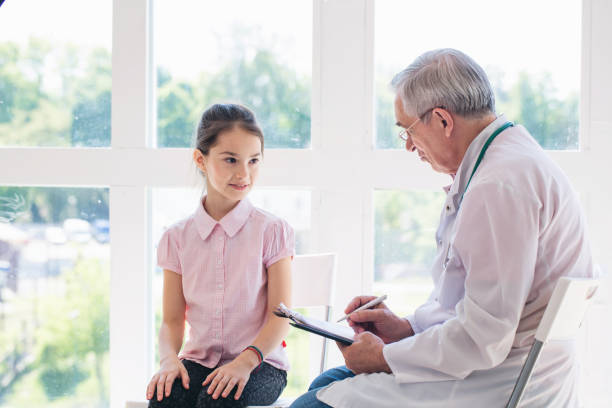 istock Pediatrician doctor examining child 1307882337