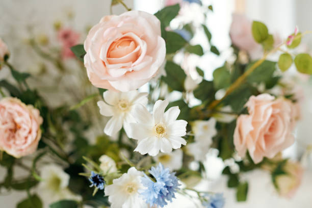 istock Wedding decorations with flowers. Beautiful flower composition in classic interior. Decoration of a banquet at a wedding with flowers. 1307882368