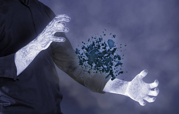 istock Frozen hands with cold stone shattering - Concept of power 1307883493