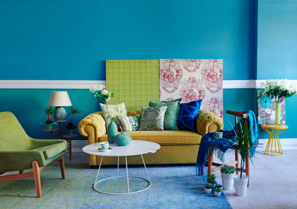 istock modern home interior blue wall with yellow sofa green armchair 1307886076