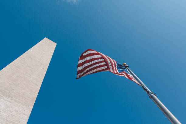istock Low Angle View Of Flag Against Clear Blue Sky 1307886182