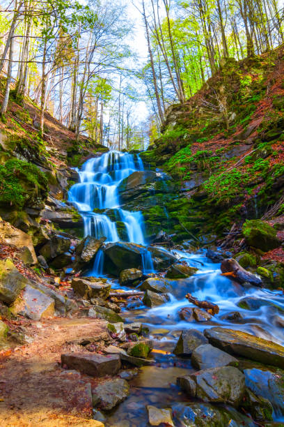 istock blue waterfall in a mountain canyon 1307886198