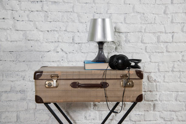 istock modern home style white brick wall old suitcase 1307886760