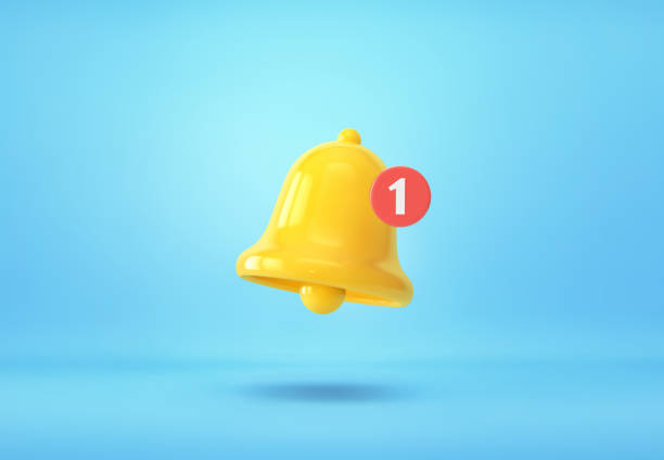 yellow notification bell with one new notification on blue background - ringing bell imagens e fotografias de stock