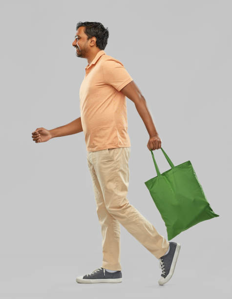 istock man with reusable canvas bag for food shopping 1307886863