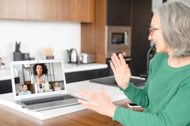 istock Mature senior woman using a laptop for video call 1307888009