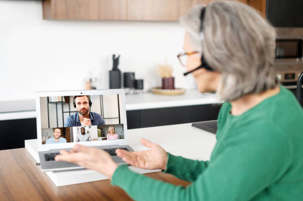 istock Mature senior woman using a laptop for video call 1307888017