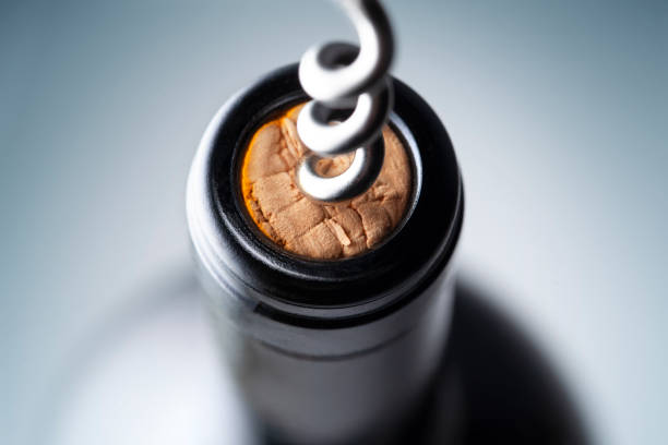 Uncorking a bottle of wine Uncorking a bottle of wine. cork stopper stock pictures, royalty-free photos & images