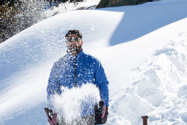 istock Man with splashing and spraying snow powder 1307890988