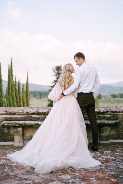 istock Rear View Of Couple Standing Against Sky 1307891484