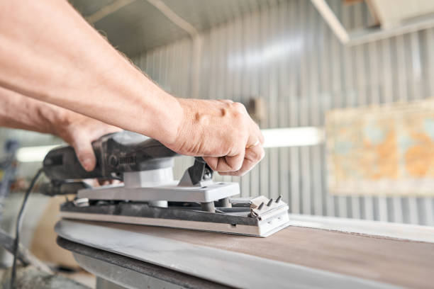 istock The mechanic works with a grinding tool. Sanding of car elements. Garage painting car service. Repairing car section after the accident. 1307892607