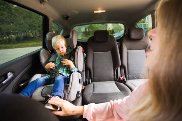 istock Mother And Son Sitting In Car 1307892883