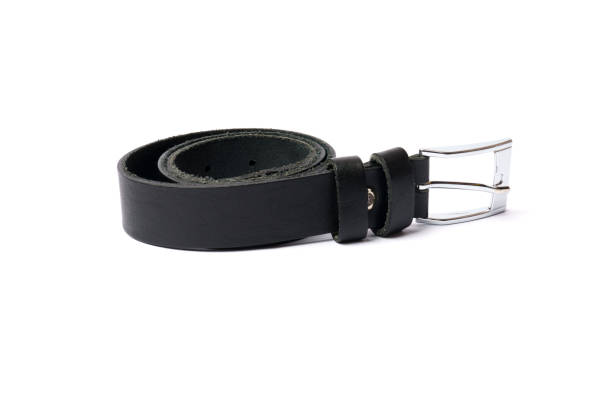 istock black leather belt isolated on white background. 1307893196