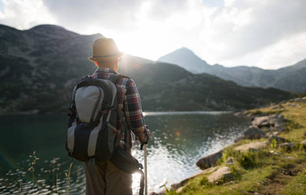 Watching lake at sunset during hiking activities