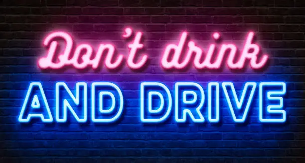 Photo of Neon sign on a brick wall - Dont drink and drive