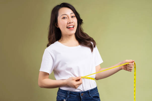 Woman holding measuring tape