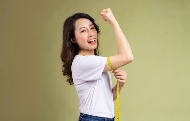 istock Woman holding measuring tape 1307895903