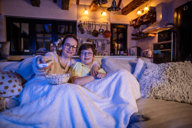 istock Mother and son watching movie 1307896115